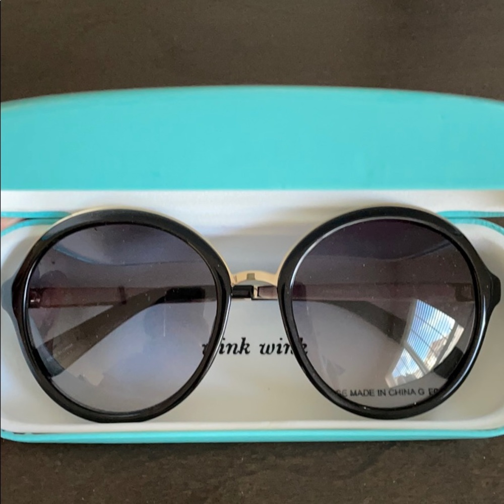 Black and gold rim Kate Spade sunglasses
